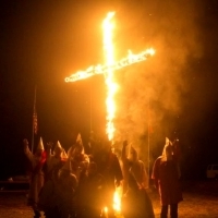 The Power of Rituals - Guideline or Risk?  Racist ritual:  Members of the Ku Klux Klan in front of a burning cross