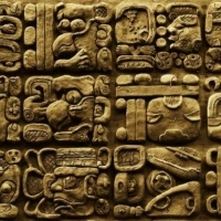 Details of the Mayan glyphs on stelae from the Mixco Viejo archaeological site in Guatemala.