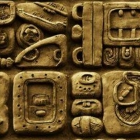 Details of the Mayan glyphs on stelae from the Mixco Viejo archaeological site in Guatemala.