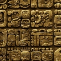 Details of the Mayan glyphs on stelae from the Mixco Viejo archaeological site in Guatemala.