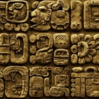 Details of the Mayan glyphs on stelae from the Mixco Viejo archaeological site in Guatemala.