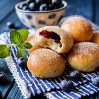 Buns with blueberries are a delicious idea for a holiday lunch.