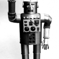 1932. Japanese engineer Yasutaro Mitsui with his steel humanoid, Tokyo, Japan.
