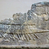 Assyrian warship, probably built by Phoenicians, with two rows of oars, relief from Nineveh, c. 700 BC.