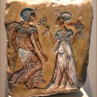 Painted limestone relief of a royal couple in the Amarna style;